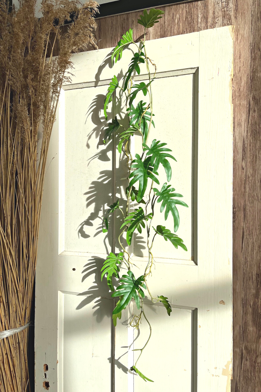 Philodendron kunstslinger 120cm sfeerbeeld. Stijl jouw ruimte of evenement met deze guirlande
